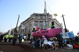 The artwork was found on boxing day and features a tribute to grenfell tower. Police Rave With Eco Warriors Chanting We Love You In Oxford Circus Daily Mail Online