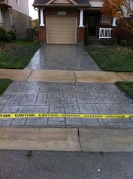 We specialize in decorative colored stamped concrete patio projects. English Yorkstone Stamped Concrete Driveway In London Ontario Concrete Driveways Stamped Concrete Driveway Concrete Decor