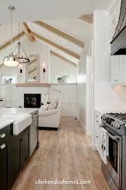 The Creek Pointe Farmhouse In 2020 White Kitchen Vaulted Ceiling Ceiling Beams Living Room Vaulted Living Rooms