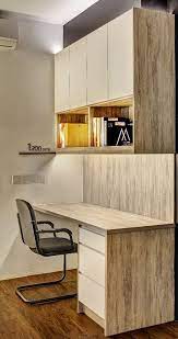 The white unit sits perfectly in a corner of the empty room with white walls and light wooden flooring. Study Room Cabinet Design