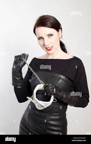 Berlin, Germany, portrait shooting a dominatrix with a necklace in hand  Stock Photo - Alamy