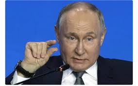 President Trump had news he was excited to share with reporters in the Oval  Office. He had just received a photo from Vladimir Putin of the two of them  from their recent