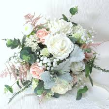 Vintage inspired bouquets have been a top wedding trend this year. Bb442 Blush And Ivory Rustic Inspired Bouquet