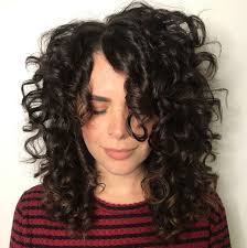Mid Length Curly Hairstyle With Off Centre Part Curly Hair Styles Naturally Mid Length Curly Hairstyles Curly Hair Styles