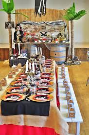 Set up a pirate ship and create your food and drink station inside. Pirates Of The Caribbean Birthday Party Kara S Party Ideas Kids Pirate Party Caribbean Party Pirate Theme Party