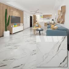 Black flower patterns appear great on the white tile floors. Time To Source Smarter Living Room Tiles Marble Flooring Design Tile Floor