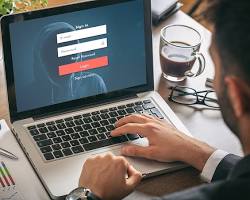 Image of person logging in to a computer