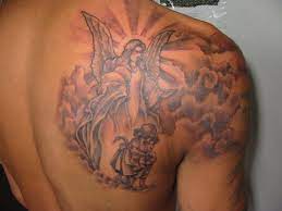 Angel And Clouds Tattoo On Left Shoulder Blade Left Trapezius Angel Tattoo Designs Shoulder Blade Tattoo Blade Tattoo