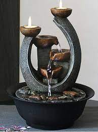 This indoor, lighted, water fountain with an electric pump is the perfect table accent with its carved look, three rock tiers between a large rock base and small log top. Multifunction Indoor Water Fountain Candle Holders With Led Lights Three Tier Soothing Cascading Tabletop Fountains With Rocks Figurines Miniatures Aliexpress