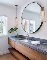 Contemporary Bathroom Features Hanging Pendants Round Mirror And Floating Vanity Countertop Espejos Para Banos Decoracion De Banos Modernos Decoracion Banos