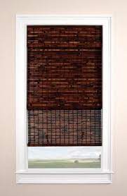 The Surprising History Of Blackout Curtains The Finishing Touch Woven Wood Shades Wood Shades Window Treatments Living Room