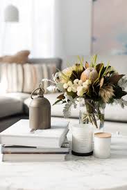 From floating candle centerpieces with candles resting in water, to minimalistic centerpieces with a few candles and sprigs of greenery, to easy diy candle centerpieces, these centerpieces will illuminate your table in the best light. The Tips And Tricks To Styling Your Coffee Table With Ease Style Curator