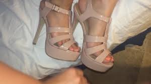 Shoejob between two sexy high heeled strappy sandals