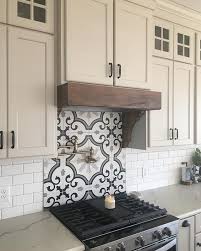 Here, a statement tile backsplash adds a contemporary feel to this small kitchen outfitted with white and wood cabinetry. 70 Best Farmhouse Kitchen Backsplash Hoods Decor Ideas In 2021 Kitchen Backsplash Farmhouse Kitchen Backsplash Backsplash