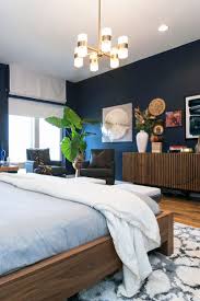 Layering Elements To Create An Eclectic Modern Look Blue Bedroom Walls Bedroom Wall Colors Bedroom Seating Area