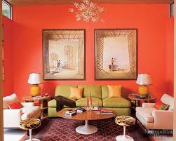 The Peachy Orange On The Wall Tinted Green On The Couch And The Purple On The Carpet Create A Triadic Room Colors Elle Decor Living Room Eclectic Living Room