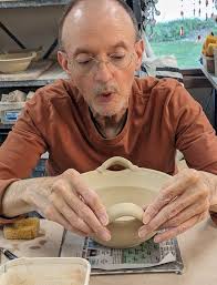Dan says it's much harder to add 2 handles to a pot than just 1 handle.  Why? Because everything about the two handles needs to match: size, design,  and placement.
