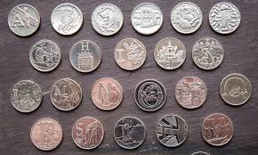 Of the cross, the letters vc to the right and the value fifty pence below Royal Mint Reveals 26 New 10p Coins This Is Money