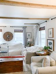 Half the room is done. Adding Beams In The Living Room Rooms For Rent Blog Farm House Living Room Rooms For Rent Living Room Decor
