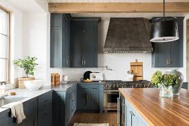 blue inset kitchen cabinets with aged