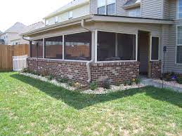 We Built This Screen Porch With A Brick Base Wall Budget Patio Concrete Patio Makeover Enclosed Patio