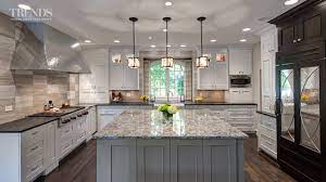 A kitchen island from worthy's run furniture is a great way to transform your kitchen without the mess or expense of a kitchen remodel. Large Transitional Kitchen Design Has Two Islands And A Mix Of White Taupe And Dark Colors Youtube