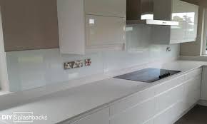 From terrazzo splashbacks and graphic hexagon tiles to herringbone designs and glamorous mirror tiles, get inspired by these stunning kitchen wall tile ideas White Glass Splashbacks