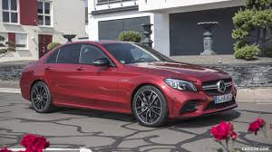 It now comes with a new twin louver grille. 2019 Mercedes Amg C43 4matic Sedan Color Hyacinth Red Front Three Quarter Caricos