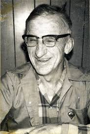 Art Cox, he was a dentist and a Woodleys coffee club member. I grab photos  from the box at random and make scans for the historical society.