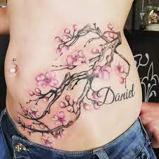 Inspirational blue black and green color ink cherry blossom flowers tattoo on rib for girls. 80 Amazing Cherry Blossom Tattoo Designs Ideas