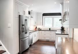 New Decor Cabinets In A Benjamin Moore Distant Gray Finish Create Functionality Bri Grey Kitchen Cabinets White Kitchen Decor Modern White Kitchen Cabinets