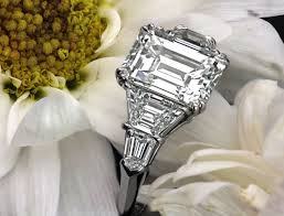 The spectacular diamond is traditionally presented between a duo of perfectly color matched tapered baguettes. Pin On Fine Jewelry