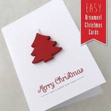 Glue a picture to the inside of the card so that it is centered in the opening (you can glue a piece of corresponding color paper over the back of the picture to create a clean finish, if desired). Easy Ornament Christmas Cards The Craft Train