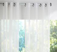 Sheer white curtains have an effortless look that's sure to add a calming touch. Outdoor Curtains Drapes Curtain Hardware Pottery Barn