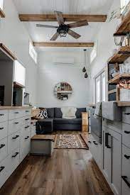 White shiplap ceiling with beams. Photo 3 Of 13 In A Globetrotting Couple S Light And Bright Tiny Home Is Born Out Of A Love For Adventure Dwell