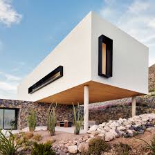 White stucco houses can look fantastic and it is one of the cleanest colors that you can choose from. Volcanic Stone Contrasts With White Stucco At Texas Desert Home By Hazelbaker Rush