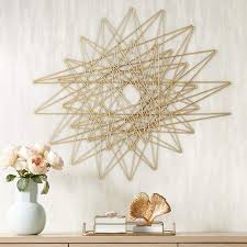 Iron wall art featuring layers of metal strips with crude edging, finished in an antique gold leaf and set on a distressed silver leaf iron backing. Emmons Gold Metal 33 3 4 X 29 Decorative Wall Art 9t857 Lamps Plus