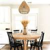 It's crafted with a distressed top and eased edges, and designed to maximize legroom and serving space. 1