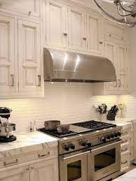This elegant white and gray kitchen showcases modern design, from the decorative tile backsplash that runs from the marble countertops to the ceiling. 35 Beautiful Kitchen Backsplash Ideas Hative