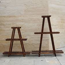 Crafted from solid fir wood and finished in brown, this piece. Durable Triangle Wooden Flower Pot Stands 3 Tier Green Plant Stand Display Shelf Fs015 Welcome To Esshelf