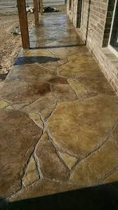This patio is stamped and colored concrete with a natural flagstone border. Stamped And Stained Concrete Patio In Flagstone Concrete Stain Patio Stain Concrete Patio Concrete Patio