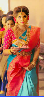 If you don't want to make it very ott with massive flowers, you can add a gajra around the bun like in this picture along. Pin By Pasupathy A On Designers Indian Bridal Indian Bridal Hairstyles Indian Wedding