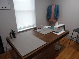 It's an ikea hack that uses shelves, a tabletop, and a few other items from the hardware store. Building An Adjustable Height Sewing Workstation Handmade By Tighe Flanagan