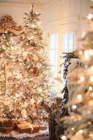 Secure the three tips together with staples. 7 Decorating Ideas For Multiple Christmas Trees In Your Home