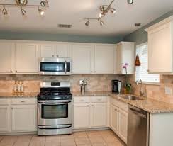 White Kitchen Cabinets Granite Countertop And Tan Walls Welcome Blue Kitchen Walls Diy Kitchen Remodel Kitchen Cabinet Remodel