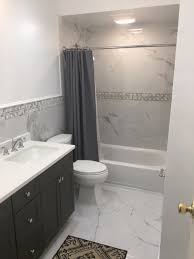 Bathroom has rainwashed walls and carrara marble countertops and shower. 75 Beautiful Marble Tile Bathroom With Black Cabinets Pictures Ideas August 2021 Houzz