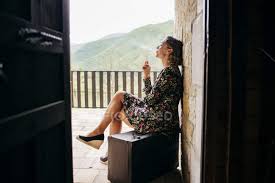 Maybe you would like to learn more about one of these? Side View Of Woman Smoking On Porch Beautiful Expression Stock Photo 179739944