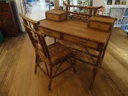 A lovingly crafted cocoon with natural bamboo frame and stylish rattan back and side panels. Faux Bamboo And Rattan Writing Desk And Chair At 1stdibs