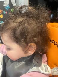 Should I trim my daughter's hair now or wait?