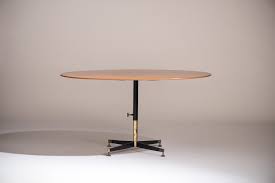 It is available in a variety of uses and is ideal for as a handy place to order a drink or snack or to have breakfast and coffee. Ignazio Gardella T 5 Adjustable Coffee Dining Table